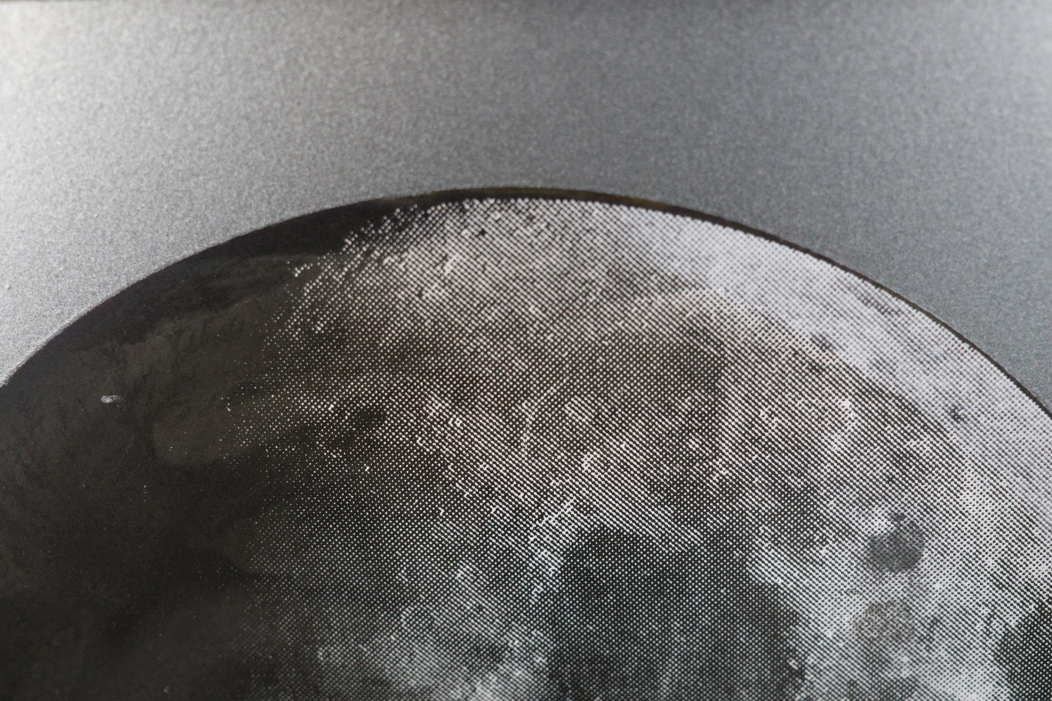 Iridescent Moon on Steel Sheet Metal